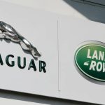 Jaguar and land rover logos on the side of a building.