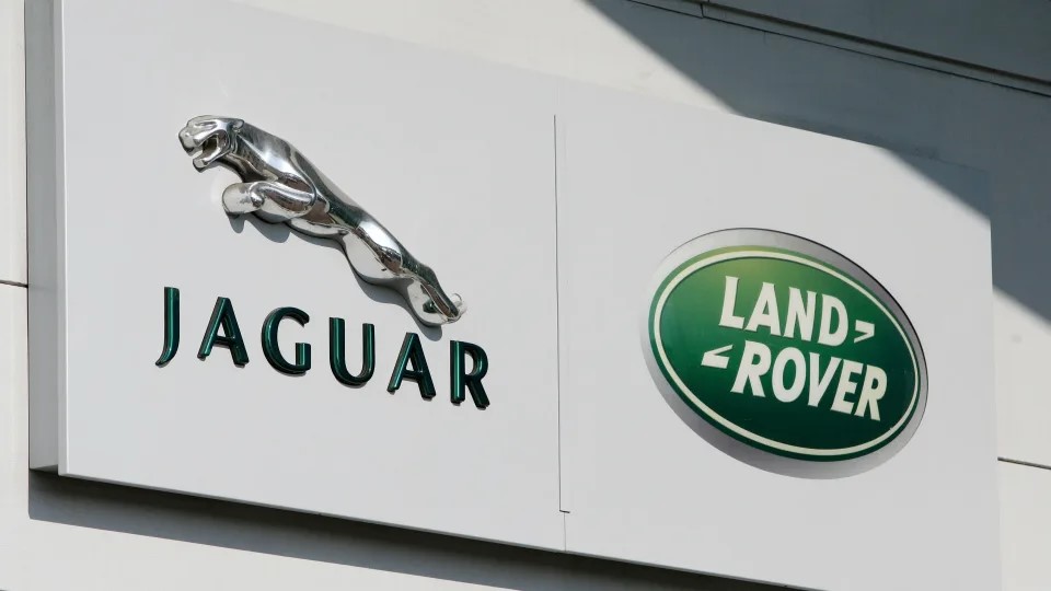 Jaguar and land rover logos on the side of a building.